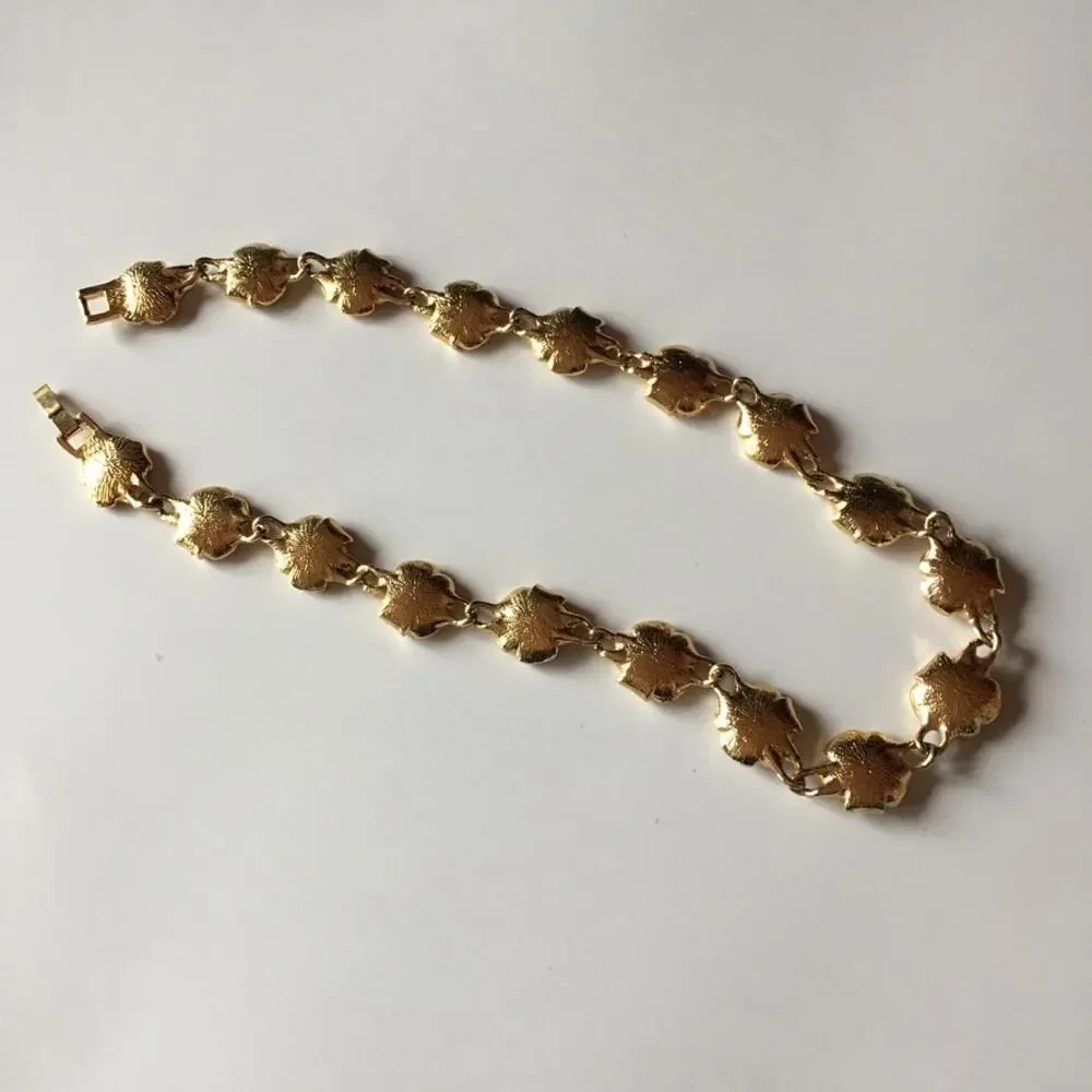 Vintage gold tone flower chain necklace with rhinestone accents